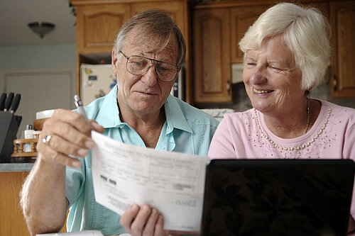 A couple sorting out their bills