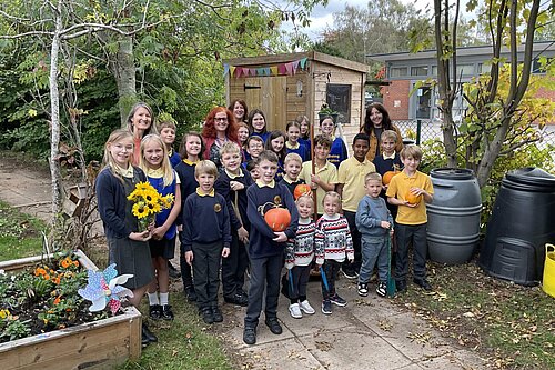 Cllr Karen Holmes meeting NMPS Children in their Wellbeing Garden and Allotment