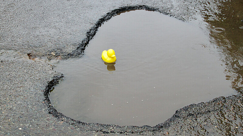 Pothole with plastic duck