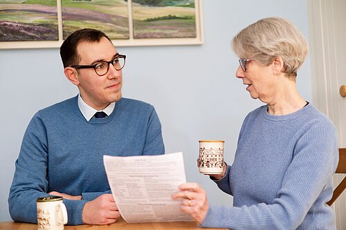Tom Gordon MP speaking to a constituent about the cost-of-living crisis