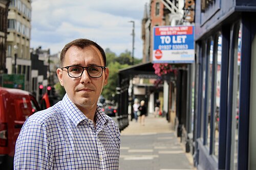 MP Tom Gordon stood outside empty high street shop with TO LET sign