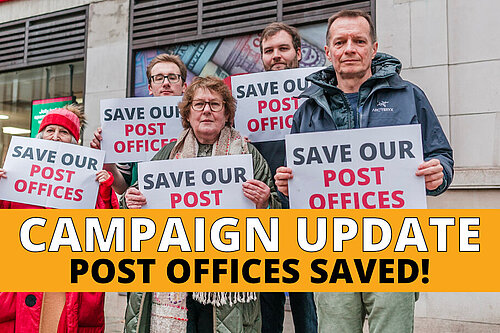 Lib Dem activists holding "save our post offices" signs outside Kensington High Street Post Office