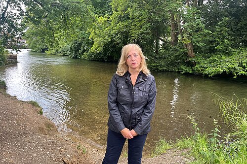 Liz Jarvis MP stood next to the River Itchen