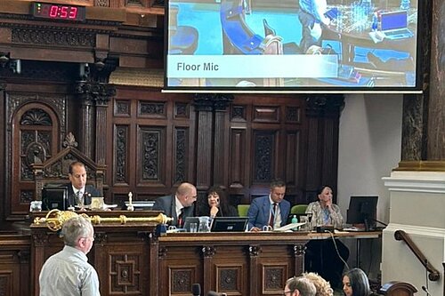 Local Lib Dem Campaigner Philip Mills asking public question pressing Council on effective enforcement of dangerous pavement parking offences