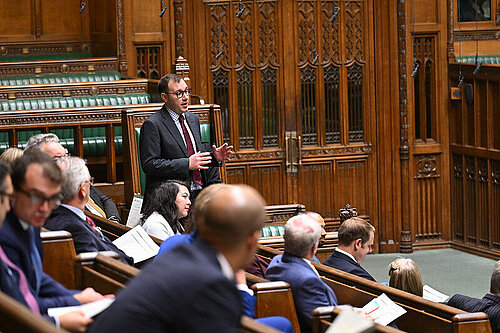 Tom Gordon stood speaking in the House of Commons 