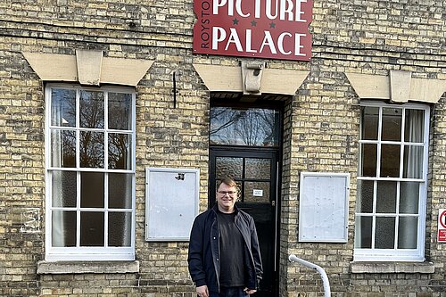 Ed Nutting outside Royston Town Hall, underneath the old Picture Palace sign above the entrance.