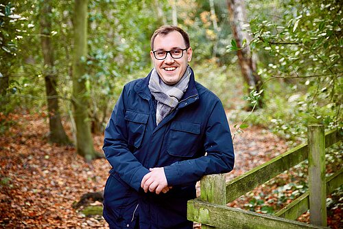 Tom Gordon smiling in a forest in Bilton