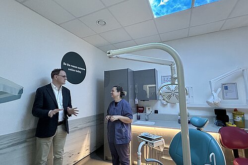 Ian talking to someone in a dentist's office