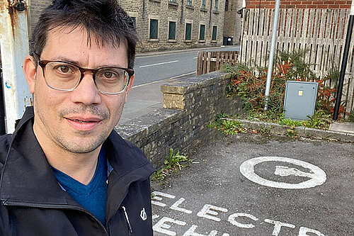 Sam Al-Hamdani at a public car charger in Lees