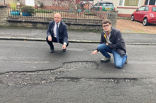 Lib Dem cllrs with potholes