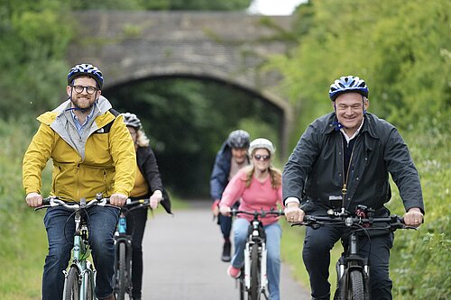 Ed Davey and Freddie van Mierlo cycling on the Pheonix Trail in Thame