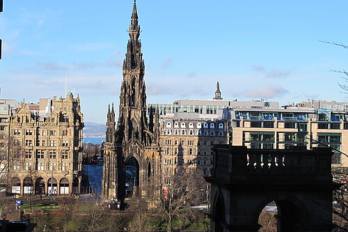 Scott Monument with Princes Street and blue skies in the background