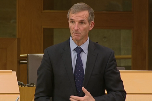 McArthur speaking in chamber