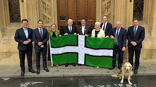 image of Devon MPs with Devon Flag