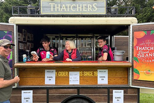 Tessa in a thatchers stand