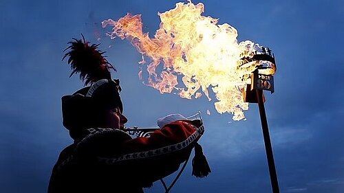 image of bugler with lit beacon