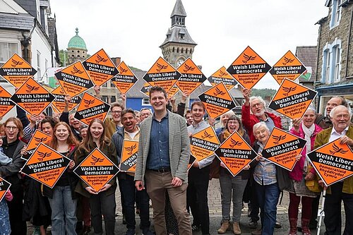 David Chadwick surrounded by Lib Dem supporters