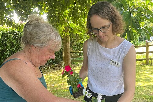 Alison and resident potting on at HHTC Carers Day