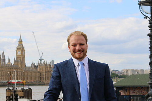 Thomas Gravatt with the Houses of Parliament in the background