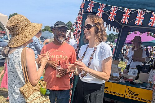 Alison and Cllr Billah at Lindfield Village day talking to local people infront of the Lib Dem Stall