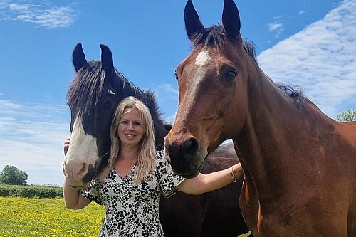 Cllr Beth Rowe with her two horses