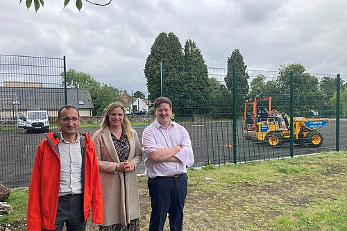 councillors standing outside the tennis courts