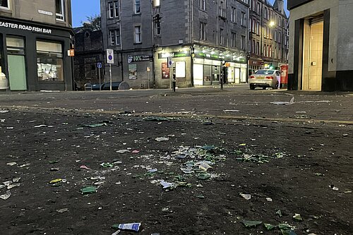 Broken glass on a pavement