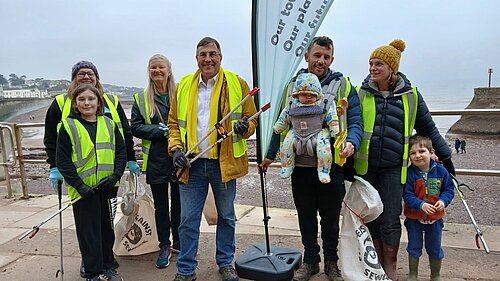 image of people at a beach clean