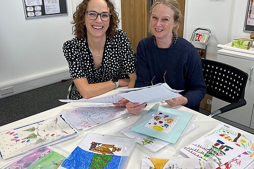 Alison and Kate looking at the entries
