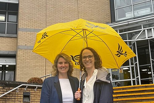 Alison with an umbrella