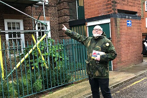 Terry Stacy pointing out Council building works
